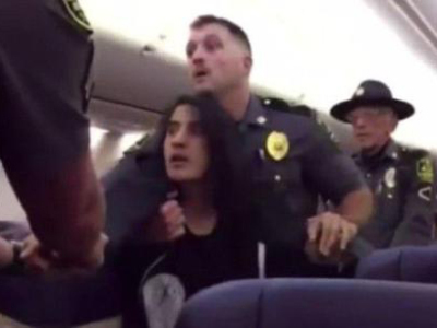 美国航班女乘客对宠物过敏 被航警强拖下飞机