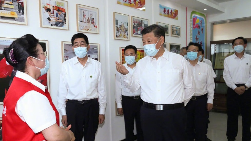 习近平谈社区治理：提高社区效能的关键是加强党的领导