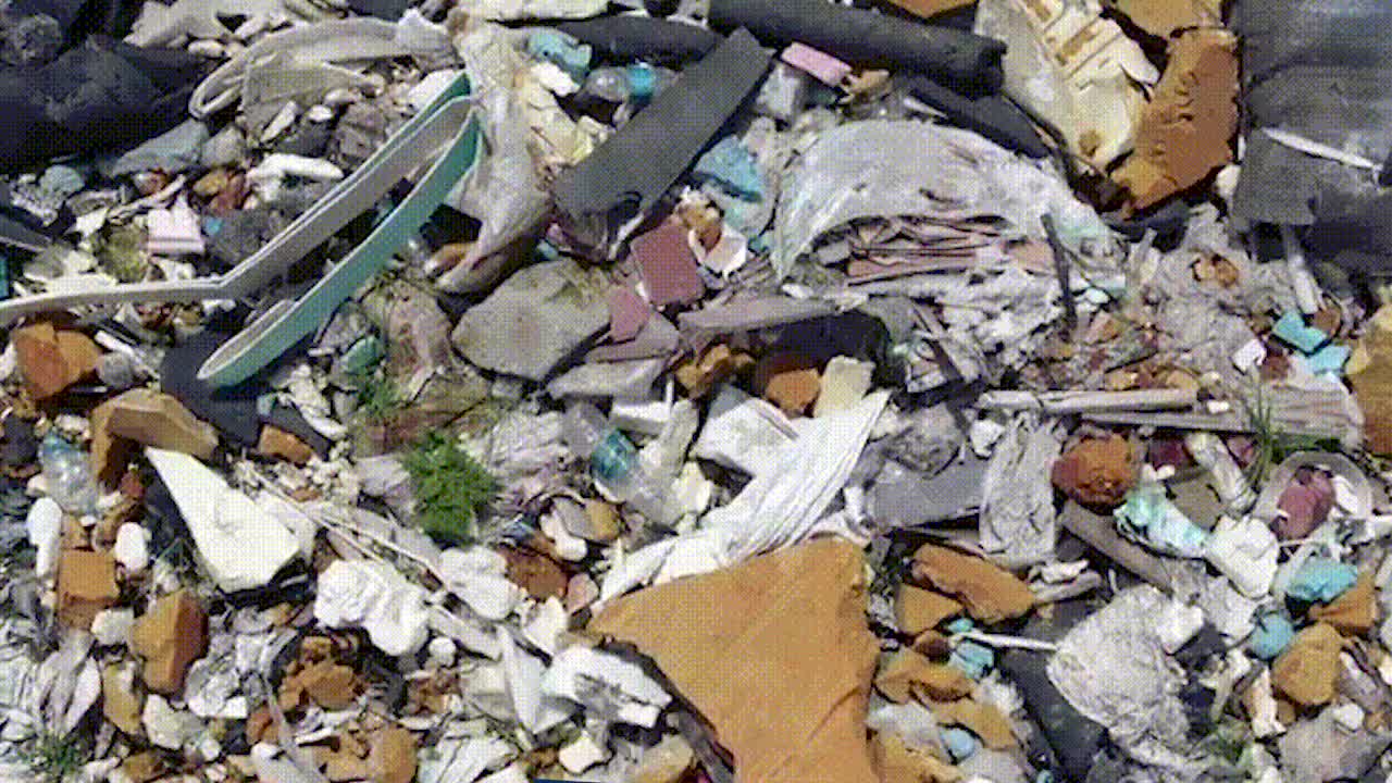 采石场复垦回填数万吨垃圾，国土部门称原方案系填土