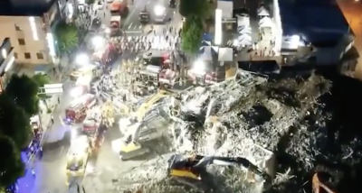 韩国一5层楼房倒塌砸中公交车 已致9死8伤