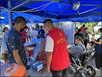 公明综合治理党支部党员向社区报到 温暖“志愿红”零距离服务群众