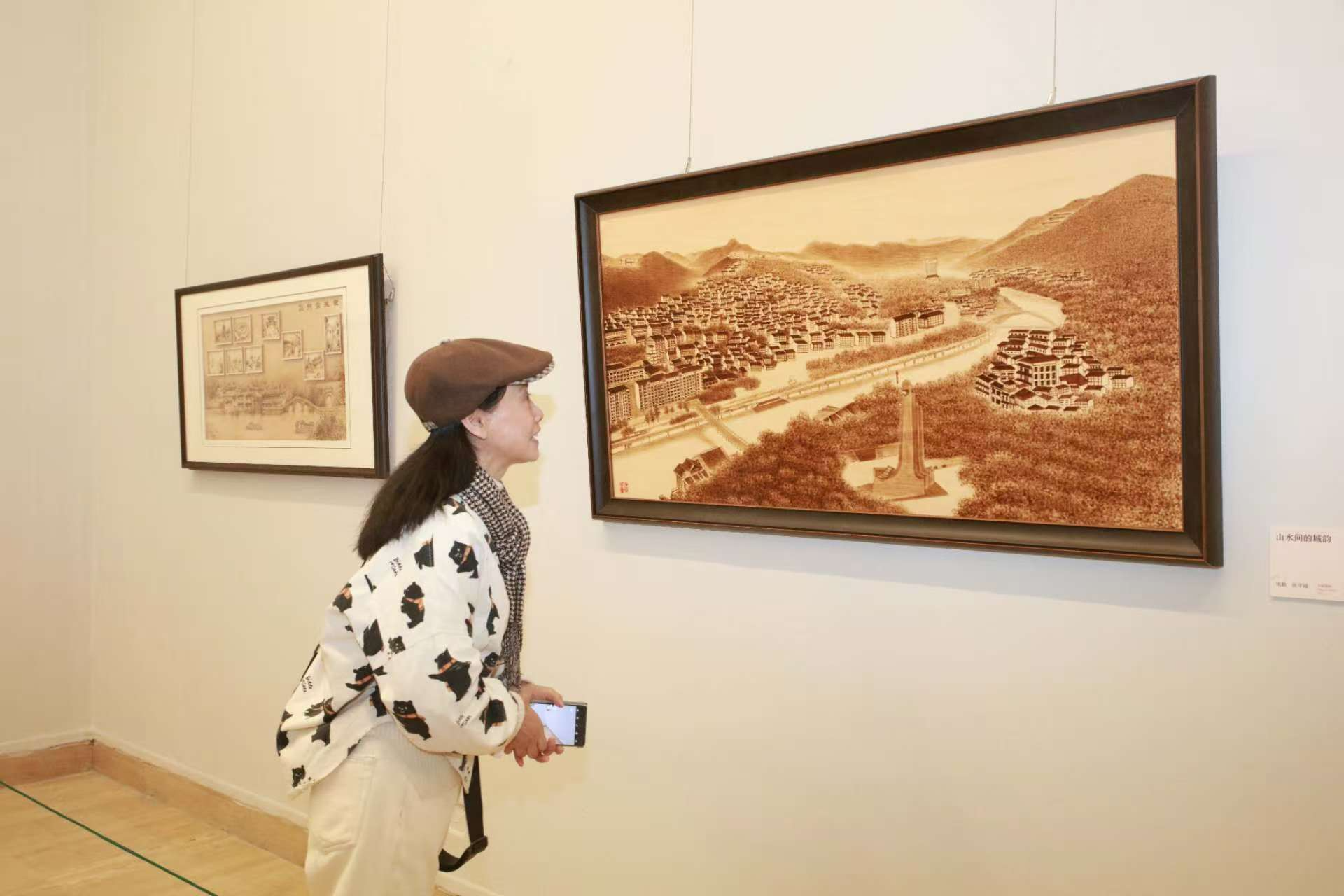 烙笔生辉，以火为墨！光明烙画携“拓荒牛”在京绽放，架起非遗交流之桥