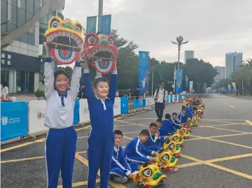 60位“醒狮娃”亮相火炬传递 用非遗传统绽放少年风采