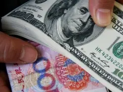 美联储如期降息,在岸、离岸人民币对美元汇率升破7.06