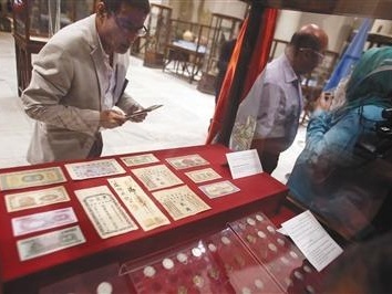 埃及首次向中国归还13件查获文物：含光绪年间银票等